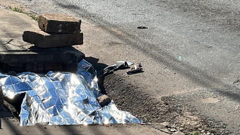 assaltante morre em bueiro